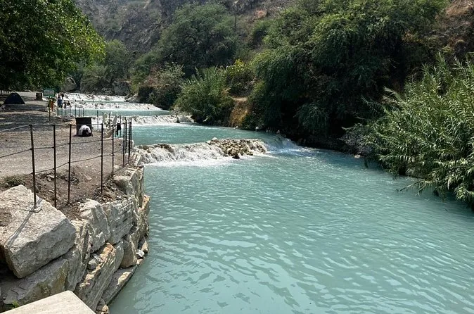 The warm turquoise river among white rocks